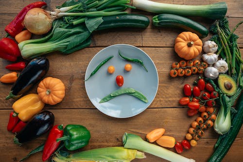 vegetables arranged in a sad face design