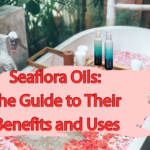 Outdoor bath with pink petals and a wooden board featuring Seaflora oils, set against a pink background with red text banner.