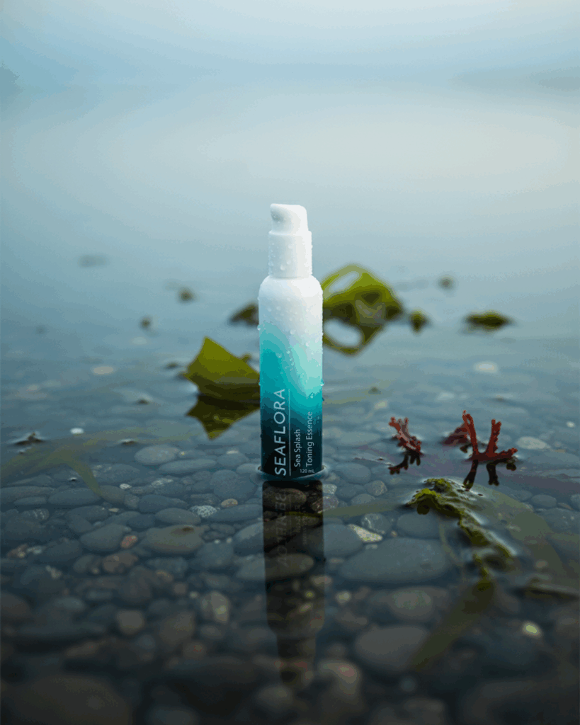 Close-up of Sea Splash Toning Essence on a background of clear sea water, emphasizing its mineral content for gut health support and a strong skin barrier.