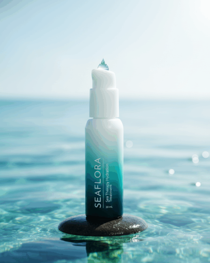 Sea-Therapy-Hydration-Treatment-Algae-Serum-Repair - Seaflora Skincare Seaflora Sea Therapy Hydration Treatment bottle placed on a wet, luminous rock, emphasizing concentrated hydration and anti-aging repair.
